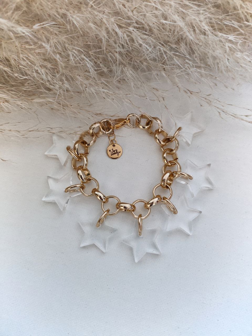 Bracciale oro con ciondoli stelle plexi