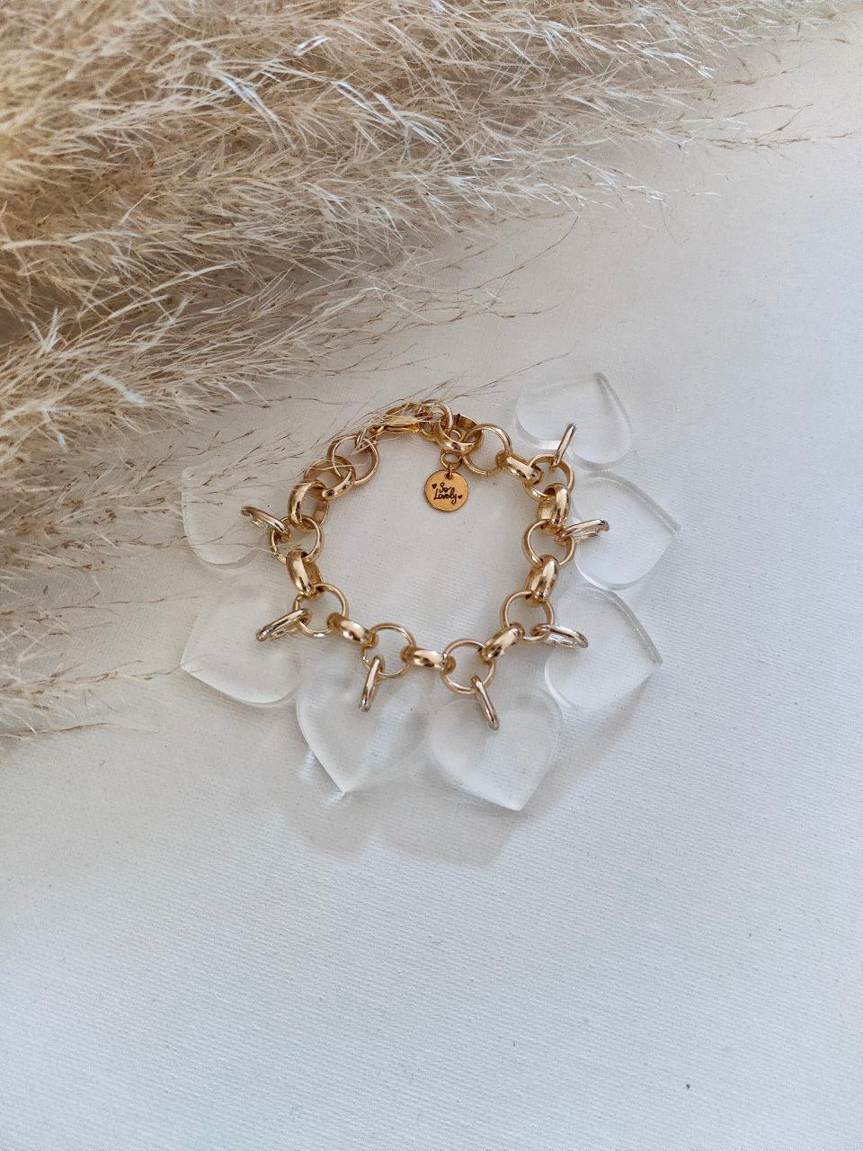 Bracciale oro con ciondoli cuori plexi