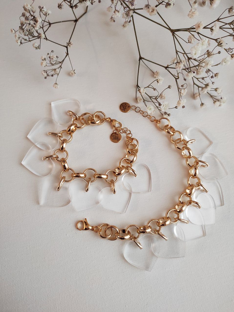 Bracciale oro con ciondoli cuori plexi